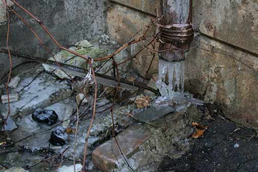 Frozen water inside a pipe.