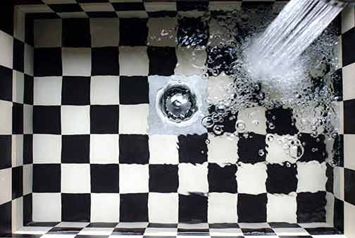  A sink filling up with water. 