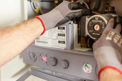 A plumber repairing power source.