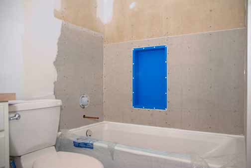 replacing drywall in a bathroom shower area