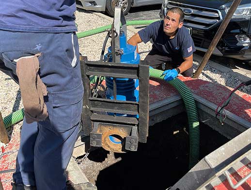 a commercial sewer systems plumber investigating a problem.