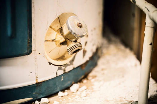 a deteriorating water heater in need of replacement.