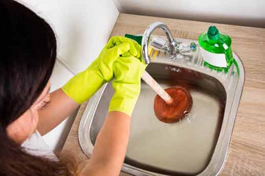 a renter cleaning her drains.