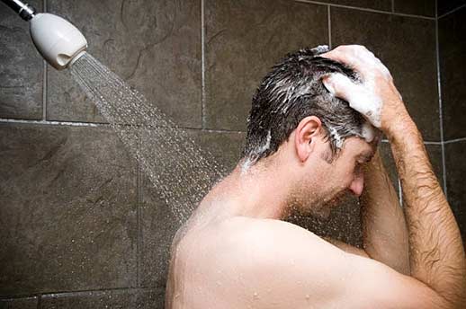 a man taking a hot water shower during holidays.