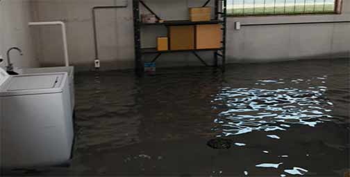 a laundry room with sewage backup