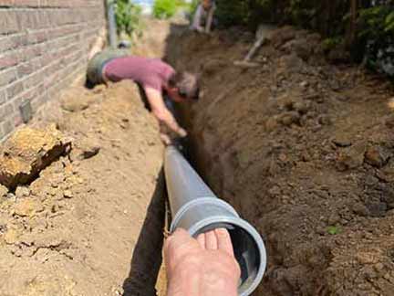 a plumber performing a main sewer line repair.