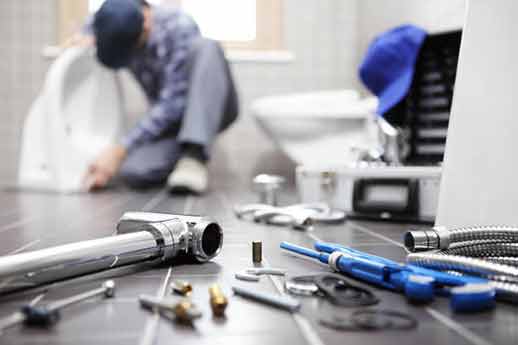 a plumber maintaining a plumbing system for a landlord.