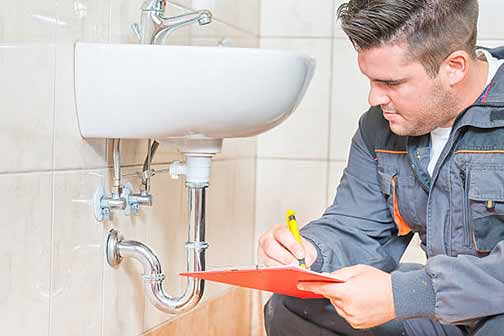 a professional plumber performing maintenance