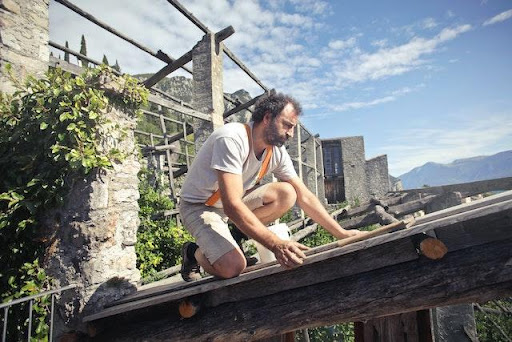 a roofer preparing a roof for winter.