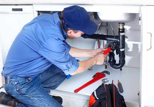 a plumber making repairs for high water pressure