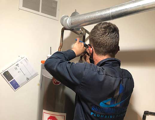 a water heater installation professional installing a new water heater.