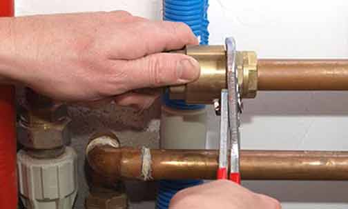 a plumber repiping a home in chicago.