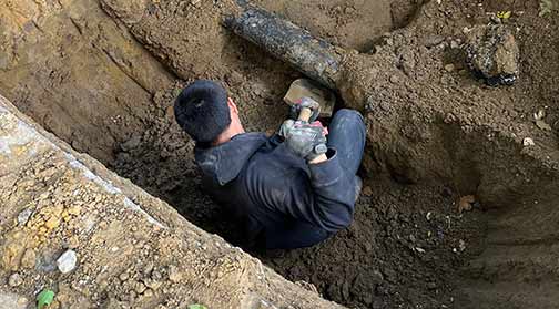 a plumber replacing water lines in chicago.