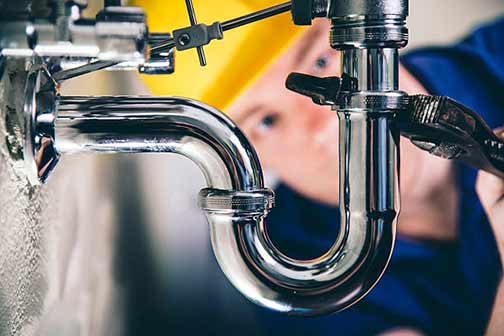 a chicago plumber making repairs at a restaurant