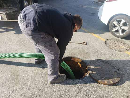 our technician cleaning business storm drains in chicago.