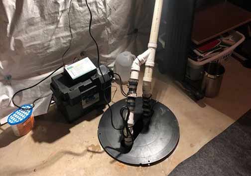 a sump pump battery backup in a basement to prevent flooding.