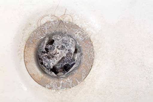 unclog a shower drain with these tips.